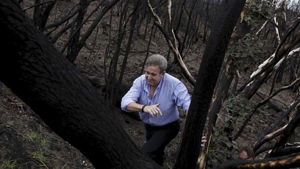 Action man &#8230; Barry O'Farrell gets a first-hand look at the fire damage in Coonabarabran.