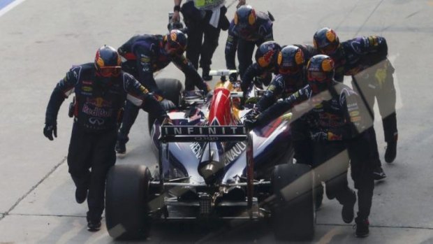 Push start: Daniel Ricciardo is pushed back to the pits after a wheel malfunction and retired shortly after.
