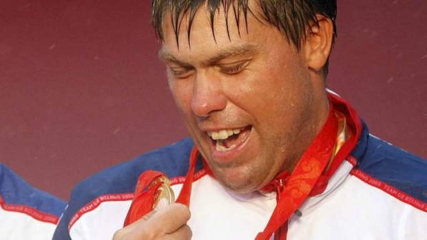Killed: Andrew Simpson poses with his gold medal at the Beijing 2008 Olympic Games.