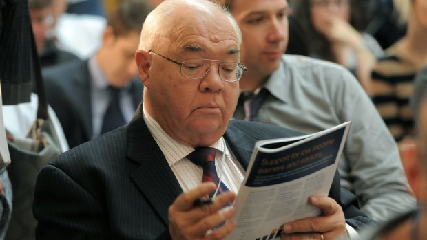 Laurie Oakes studies the form during the 2011-2012 Federal Budget lock up and press conference at Parliament House Canberra.