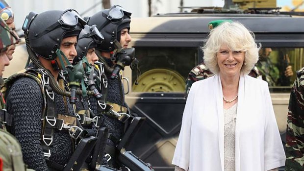 Camilla, Duchess of Cornwall, inspects paratroopers at the start of a three-day visit to Morocco with Prince Charles.