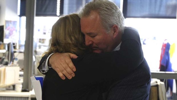 Leaving together ... Peter Fray hugs Amanda Wilson after their announcements to staff today.