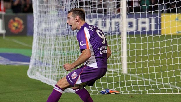 Shane Smeltz celebrates in front of the fans after scoring.