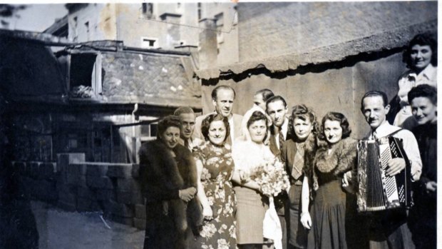 Erna and Wilek Rosner's wedding in Munich, Germany in September 22,1946. Oskar Schindler is the tall man in the back. Leo Rosner with accordion; Rosner's wife Helen is left of him.

