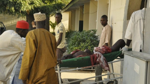 A injured man is wheeled into hospital, following an explosion at a Mosque, in Kano, Nigeria, 