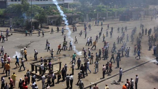 Supporters of Egypt's ousted president Mohamed Mursi clash with security forces.