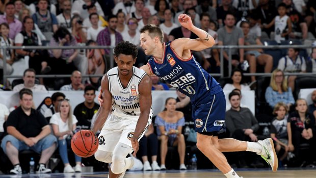 Class act: Melbourne guard Casper Ware evades Nathan Sobey of the 36ers.