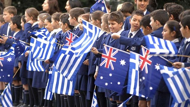 Tight communities ... children wave Greek and Australian flags in Sydney.