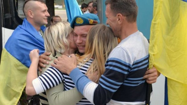 Ukrainian servicemen return from fighting pro-Russian separatists in the country's east.