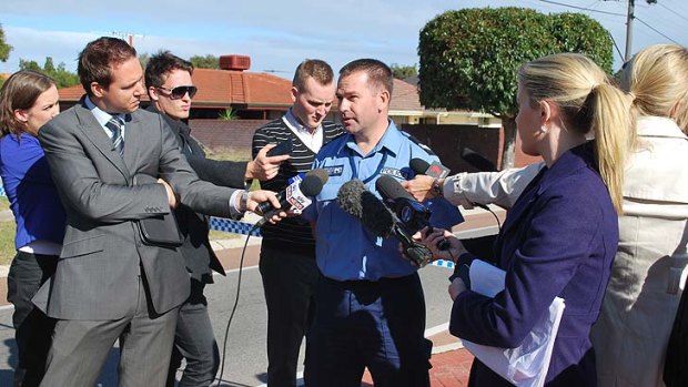 Senior Constable Pete Price talks to media near the scene of the accident that claimed the life of an 11-year-old boy riding his bike to school.