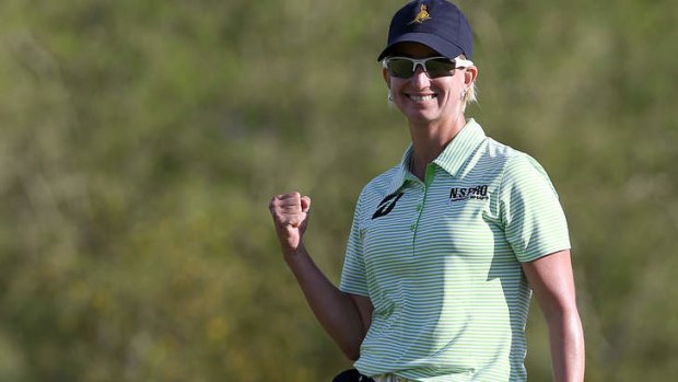 Karrie Webb of Australia celebrates a birdie on the 18th green as she fired a final round of 63.