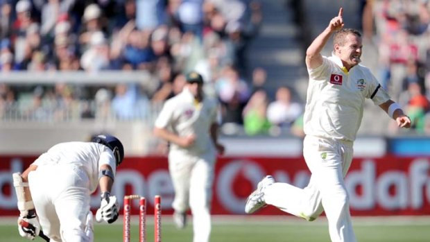 Bowled ... Peter Siddle claims Sachin Tendulkar's wicket late in the day.