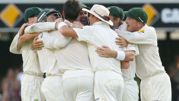 Australia celebrate victory after Mitchell Johnson of Australia took the wicket of James Anderson of England to win the test.