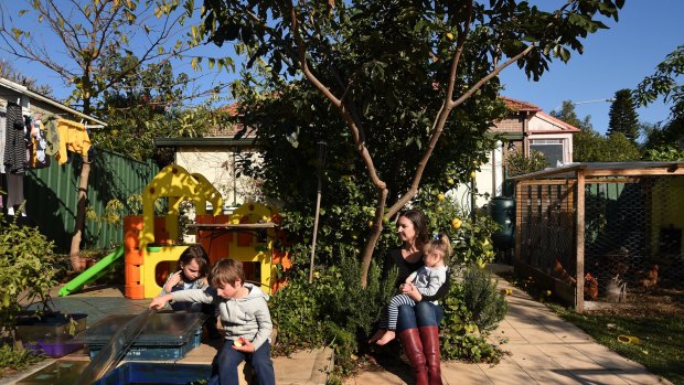 Elizabeth Slakey with her children (from left) Luca, 8, Declan, 5, and Pippi, 2. They are among those affected by the WestConnex project.