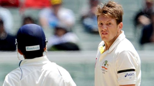 If looks could kill ... Australian paceman James Pattinson glares at Indian batsman Gautam Gambhir.