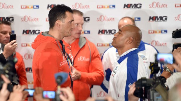 Wladimir Klitschko of Ukraine and Alex Leapai of Australia face off in Germany ahead of their heavyweight title fight.