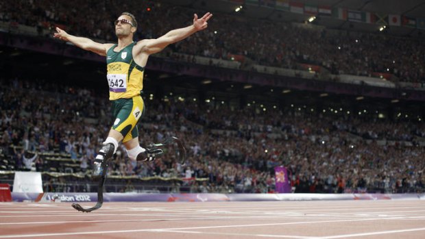Winner ... South Africa's Oscar Pistorius crosses the line to take gold in the men's 400m - T44 final.