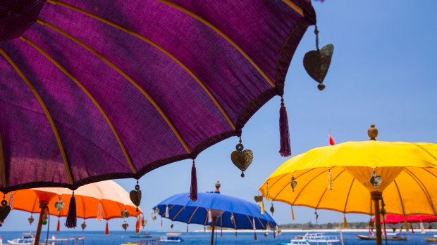 Colorful beach umbrellas on beach, Gili Trawangan, Lombok.