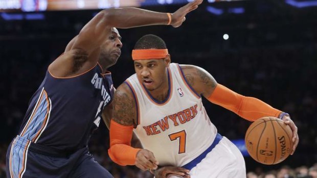 New York Knicks forward Carmelo Anthony drives past Charlotte Bobcats opponent Anthony Tolliver during the first half of an NBA pre-season game in New York.