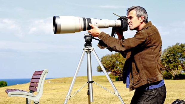 Long shot ... Ben Rushton aims for his subject using a Canon EOS 1D Mark IV camera, a 600 millimetre lens and a 2x converter to double the magnification of the lens. He shot with a 1/1000th second shutter speed.