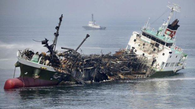 The Shoko Maru lists before sinking after a massive explosion rocked the Japanese tanker.