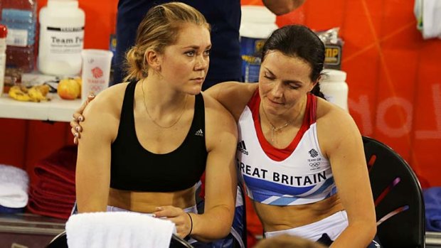 Britain's Victoria Pendleton, right, puts an arm around teammate Jessica Varnish.