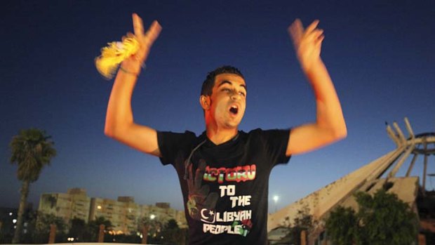 Cause for joy ... in Sirte, a man celebrates the end of voting day.