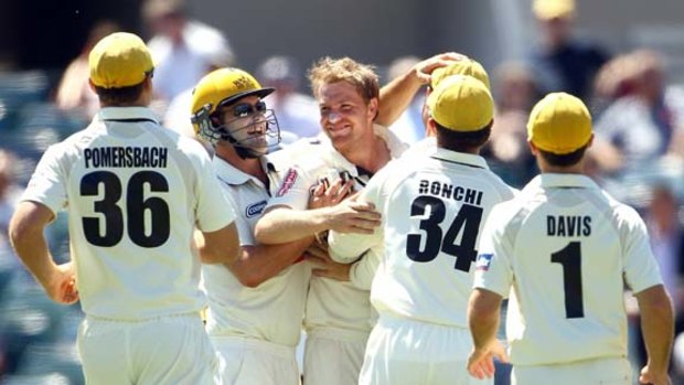 Michael Beer celebrates the wicket of Matt Prior during the Tour Match between the Western Australia Warriors and England at the WACA on November 6.