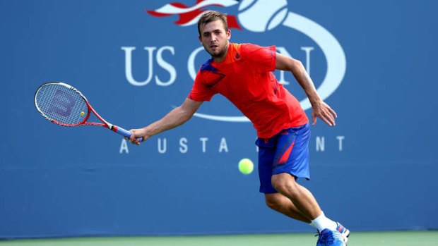 Daniel Evans of Great Britain in action against Bernard Tomic on day four of the 2013 US Open.