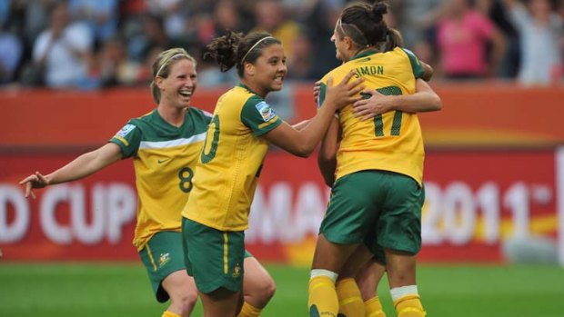 Australia's Kyah Simon celebrates a goal with her teammates.