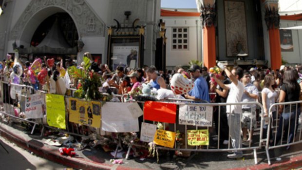 Fans line up to see Michael Jackson's star on the Hollywood Walk of Fame in Los Angeles.