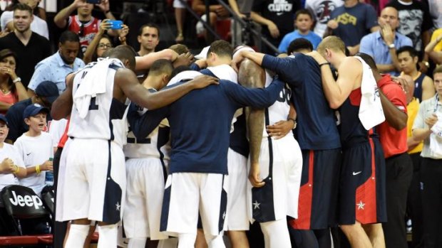 Togetherness: Team USA gather in a huddle after Paul George's injury.