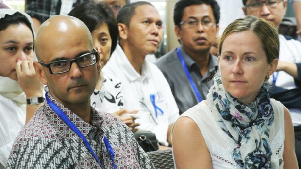 Neil Bantleman (front), with  wife Tracy, at the Jakarta International School on the day he was taken into police custody.