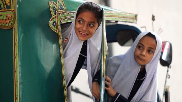 Faces of the future: Girls leave Malala Yousufzai's old school in Mingora.