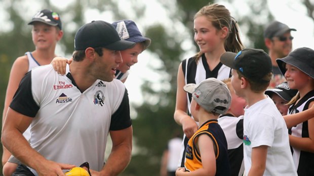 Travis Cloke was looking behind him yesterday as the Collingwood players put on a clinic for children at Mansfield, but after a troubled 2009, the Magpie is looking forward to a big 2010.