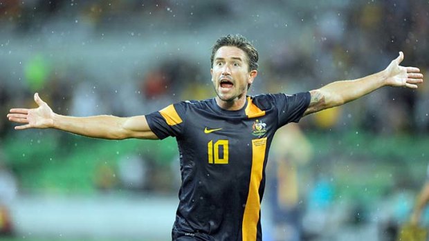 Harry Kewell protests to the referee after a ruling went against him.