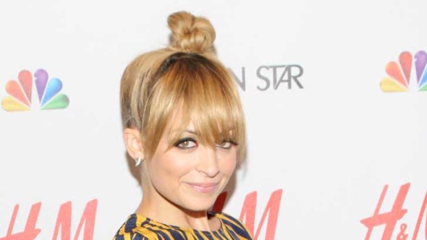 Nicole Richie, who stands at 152cm, says she has trouble finding clothes that fit - and instead has a penchant for heels and bags (and high hairdos).