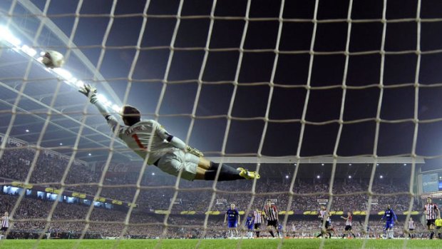 Desperate dive ... Athletic Bilbao's goalkeeper Gorka Iraizoz tries to stop a goal by Wayne Rooney.