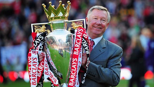 Always a winner: Sir Alex Ferguson holds this year's English Premiership trophy.