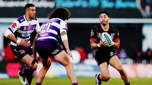 Magician: Shaun Johnson eyes up the Storm defence in the Warriors' victory on Sunday.