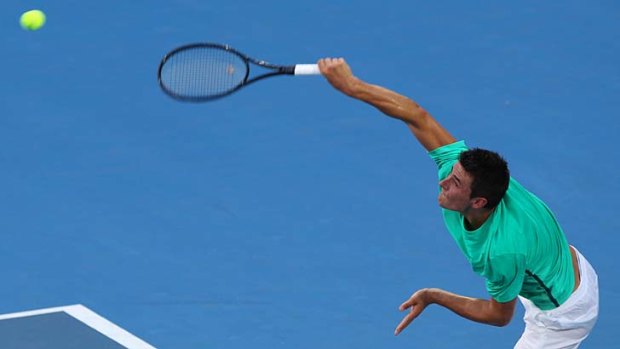 In control ... Bernard Tomic notches another home win - his 13th in 15 matches.