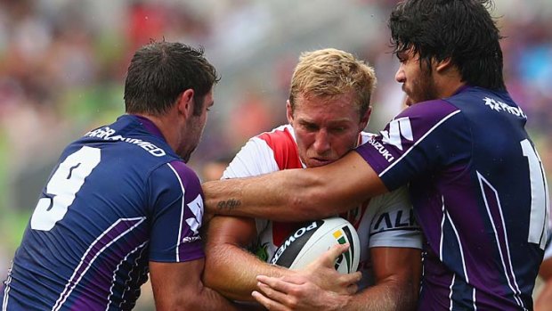 No way through: Matt Prior of the Dragons is tackled by Cameron Smith and Tohu Harris of the Storm.