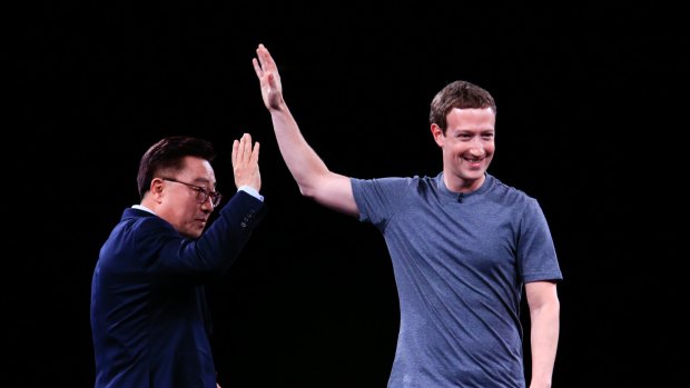 Facebook's Mark Zuckerberg makes a surprise appearance onstage, taking over from  Samsung's president of mobile communications Koh Dong Jin.