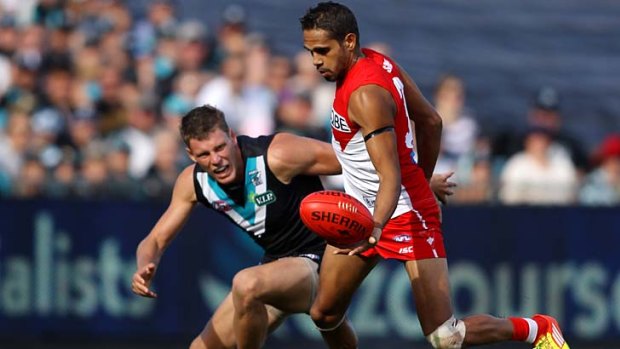Lewis Jetta of the Swans gets away from Brad Ebert.