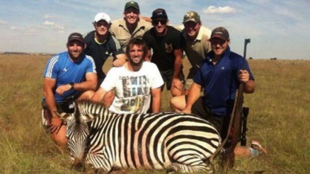 Courting controversy: Crusaders players George Whitelock, Tyler Bleyendaal, Sam Whitelock, Tom Taylor and Ben Funnell with guides on a hunt in South Africa.