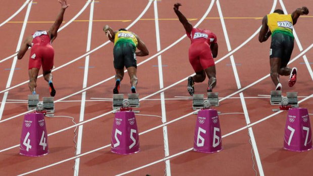 Usain Bolt sets off with the plastic bottle just behind him.