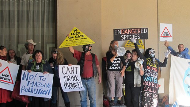 Anti-coal seam gas protestors rally outside the annual CSG summit in Brisbane today.