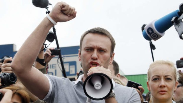 Defiant: Russian opposition leader Alexei Navalny addresses supporters and journalists after in Moscow.