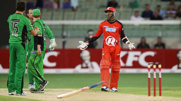Marlon Samuels (right) throws his bat in front of Shane Warne during a heated exchange.