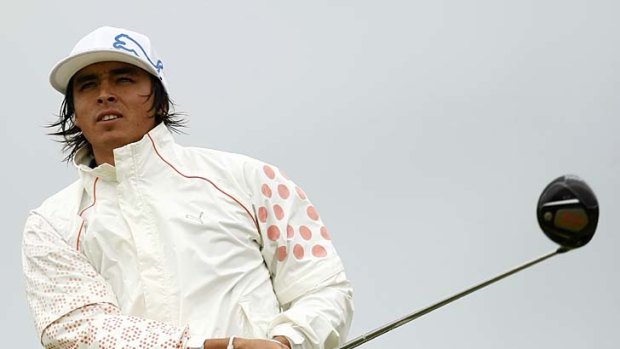 Rickie Fowler tees off on the 18th hole.